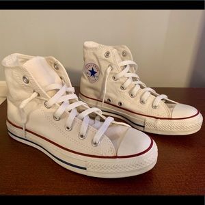 White hightop Converse.